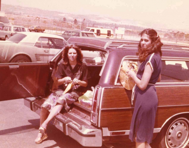 Danette & Kristy in the station wagon.  (Check out all the wagons in the parking lot.  The van too and even a Pinto!)
